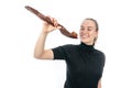 Young vegetarian woman is holding a huge spoon with a strawberry on it Royalty Free Stock Photo