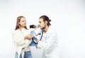 Young veterinarian doctor in blue gloves examine little cute dog jack russell isolated on white background with owner Royalty Free Stock Photo