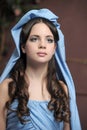 Young victorian lady in a blue cape Royalty Free Stock Photo
