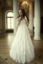 Young victorian lady in white dress