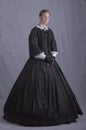 Young Victorian woman in black ensemble with a white lace collar Royalty Free Stock Photo