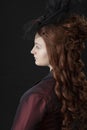 A young Victorian woman in a dark red and black ensemble Royalty Free Stock Photo