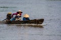 Young vietnamese floats in a canoe