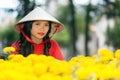 Young Vietnamese woman in a traditional hat