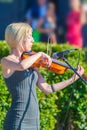 Young violinist playing in the park