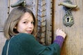 young visitor knocking on museum door