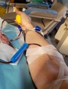 young volunteer during the donation blood in the bed of a medica