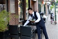 A young waiter is at work in Hoorn, Holland