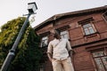 Young waiting african man is standing on street in city Royalty Free Stock Photo