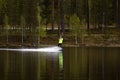 Young wakeboarder rides a wakeboard on the lake. Wakeboarding is cool, extreme sport