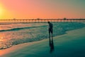 Young walking during sunset on Pimentel Peru beach Royalty Free Stock Photo