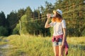 Young walking teen girl drinking water from bottle Royalty Free Stock Photo