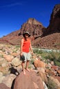 Young waoman backpacker by Hance Rapids in the Grand Canyon.