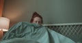 Young weak redhead ginger woman has no stength she poes to bed