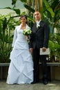 Young wedded couple in garden Royalty Free Stock Photo