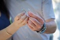 Young wedding couple on a beach showing their rings. Focus on hands . Bride and groom showing wedding rings Royalty Free Stock Photo