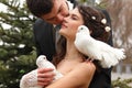 Young wedding couple with pigeons pair, broom kiss bride over pa Royalty Free Stock Photo