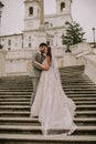 Young wedding couple on Spanish stairs in Rome Royalty Free Stock Photo