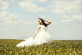 Pretty wedding girl on green grass and sky Royalty Free Stock Photo