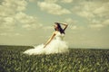 Pretty wedding girl on green grass and sky Royalty Free Stock Photo
