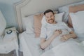 Young well rested man waking up in morning at home Royalty Free Stock Photo