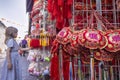 Young western tourist looking at the Chinese New Year decoration in Chinatown