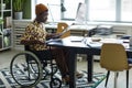 Young Wheelchair User in Office