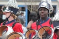 Young white boy and black boy drummers in a marching band in the Cherry Blossom Festival in Macon, GA