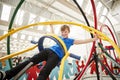 Young white boy having fun using a human gyroscope