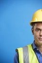 Young white construction worker in hard hat, vertical, crop