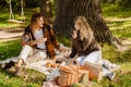 Young white couple in love enjoying picnic time in park