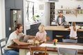 Young white family busy in their kitchen, elevated view Royalty Free Stock Photo