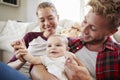 Young white family playing together in the sitting room Royalty Free Stock Photo