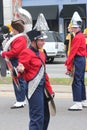 Young white female cymbal player in a marching band in the Cherry Blossom Festival in Macon, GA