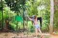 Young white girl hanging out the clothes to dry after washing Royalty Free Stock Photo