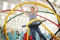 Young white girl having fun using a human gyroscope