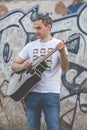 Musician plays an elegant black guitar, Spain