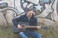 Musician plays an elegant black guitar, Spain