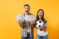 Young win couple, woman man, football fans holding bundle of dollars, cash money, soccer ball, cheer up support team Royalty Free Stock Photo