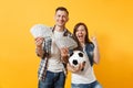 Young win couple, woman man, football fans holding bundle of dollars, cash money, soccer ball, cheer up support team Royalty Free Stock Photo