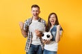 Young win couple, woman man, football fans holding bundle of dollars, cash money, soccer ball, cheer up support team Royalty Free Stock Photo