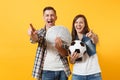 Young win couple, woman man, football fans holding bundle of dollars, cash money, soccer ball, cheer up support team Royalty Free Stock Photo