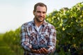 Young winemaker in vineyard