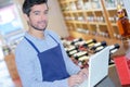 Young winemaker working with laptop