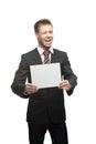 Young winking businessman holding sign Royalty Free Stock Photo