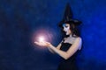 Young witch doing magic Royalty Free Stock Photo