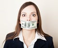 Young woman with 100 dollars on her mouth Royalty Free Stock Photo