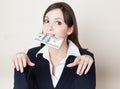 Young woman with 100 dollars in her mouth Royalty Free Stock Photo