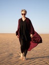 Young woman with abaya in the Salisil desert in Saudi Arabia Royalty Free Stock Photo