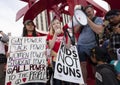 Young woman addressing crowd with megaphone at gun violence protest Royalty Free Stock Photo